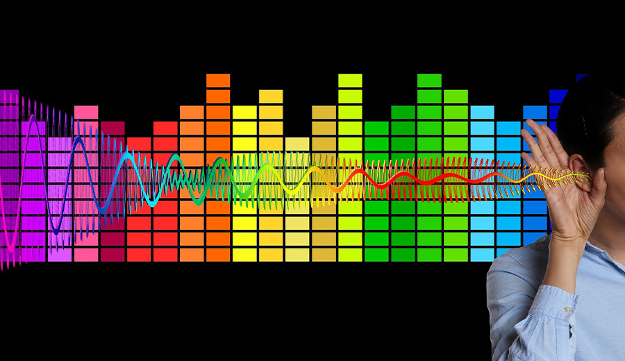 Child listens intently, hand to ear, against a background of colorful, digital sound wave graphics.